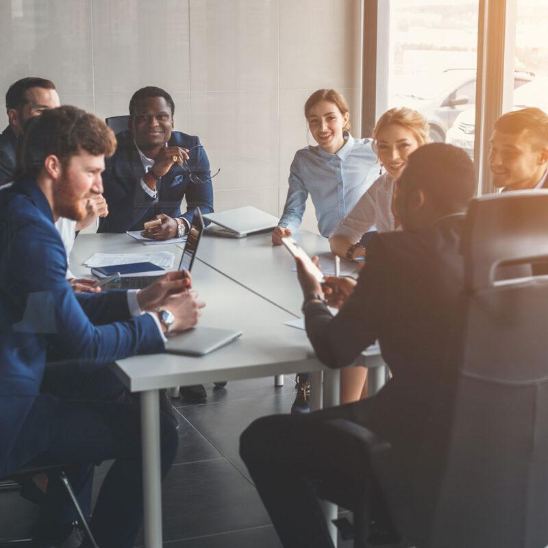 S3 Security staff work together in conference room.