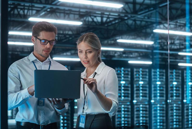 S3 Security engineers working in server room.